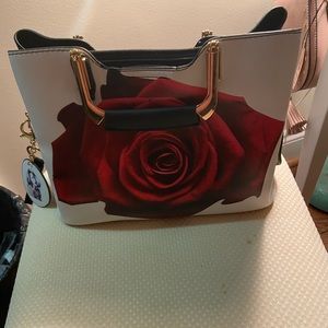 Hand purse with rose